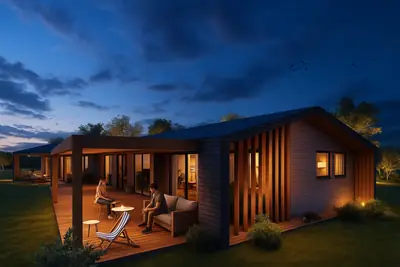 Casa AB: vivienda de madera con terraza y celosías, al atardecer